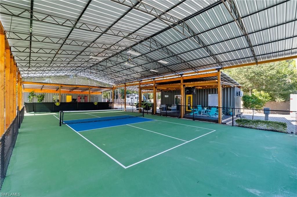 6610 Sable Ridge Lane Naples, FL 34109 - Photo 33 of 47 a view of a room with tennis court