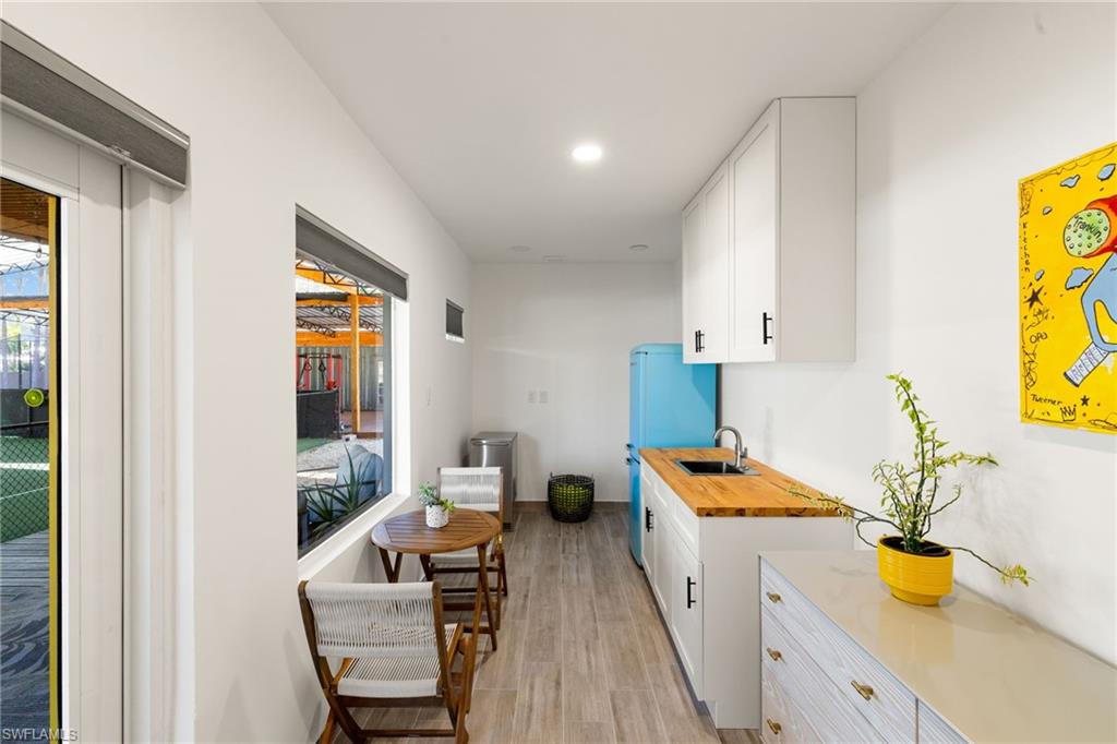 6610 Sable Ridge Lane Naples, FL 34109 - Photo 34 of 47 a kitchen with stainless steel appliances a stove a sink and a refrigerator