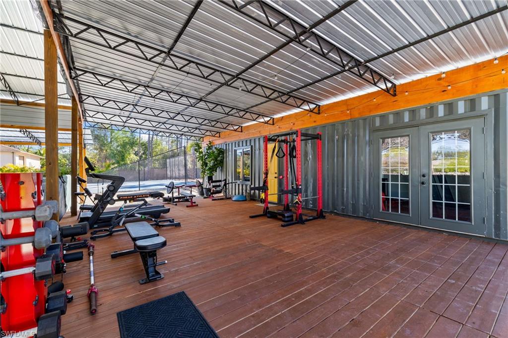 6610 Sable Ridge Lane Naples, FL 34109 - Photo 36 of 47 a view of a room with gym equipment