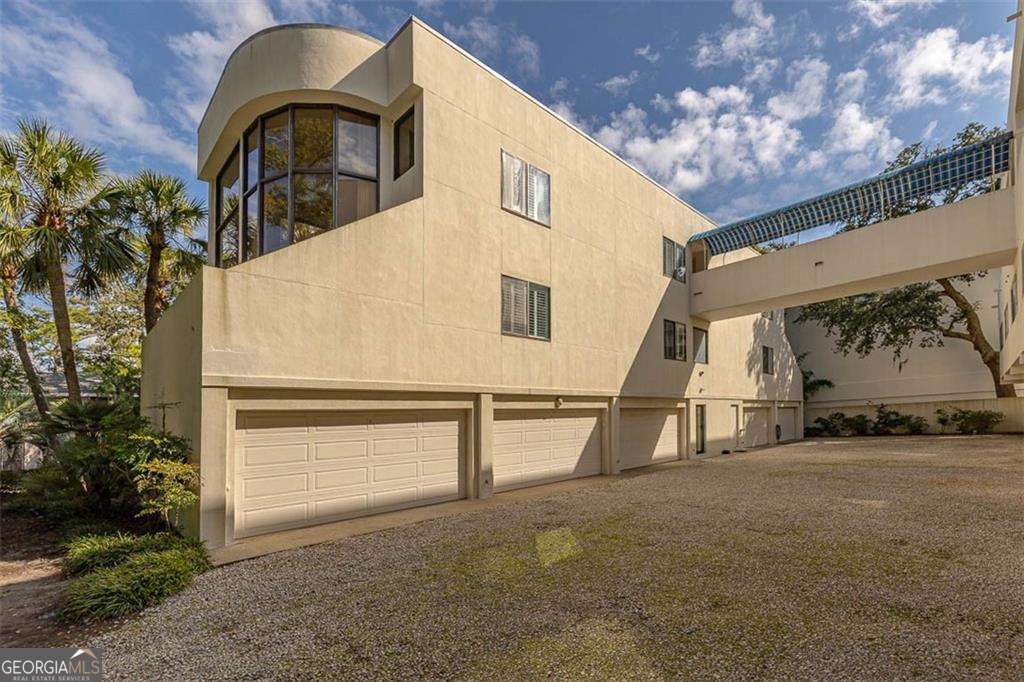 548 Oglethorpe Avenue, Unit 11 St. Simons, GA 31522 - Photo 4 of 25 a view of swimming pool with a yard