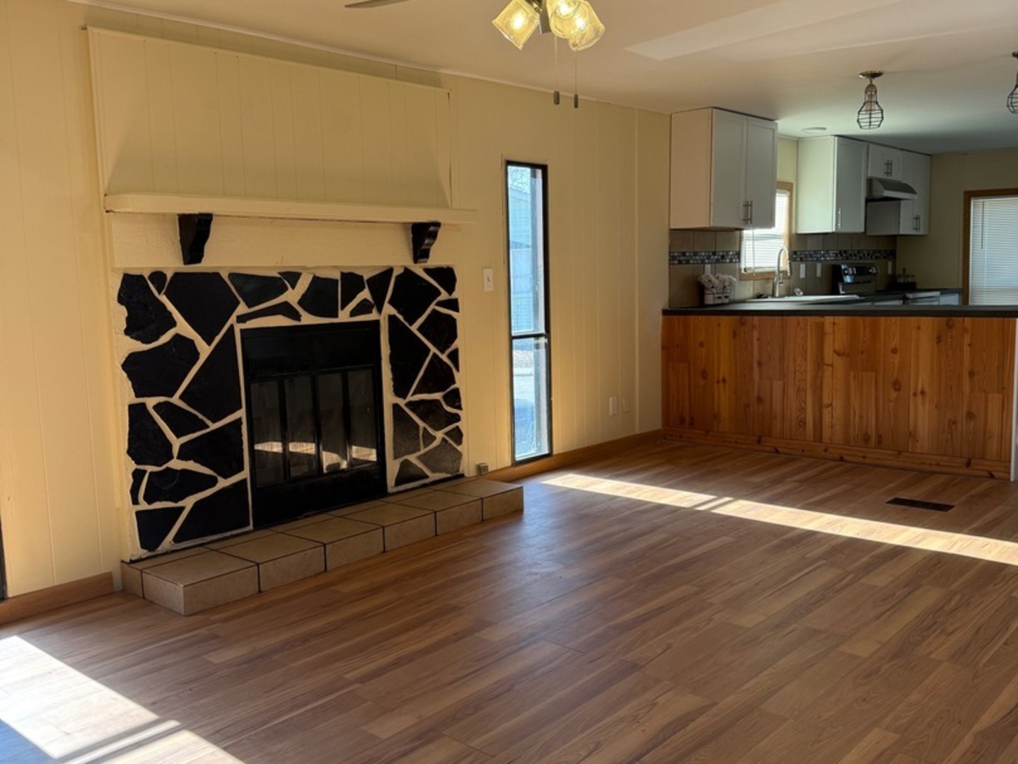 38455 North Sheridan Road, Unit 732 Beach Park, IL 60087 - Photo 11 of 25 a view of a room with wooden floor and cabinets