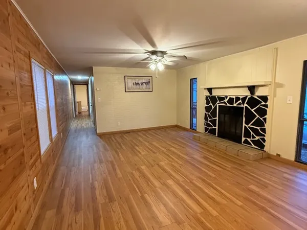 a view of a livingroom with wooden floor
