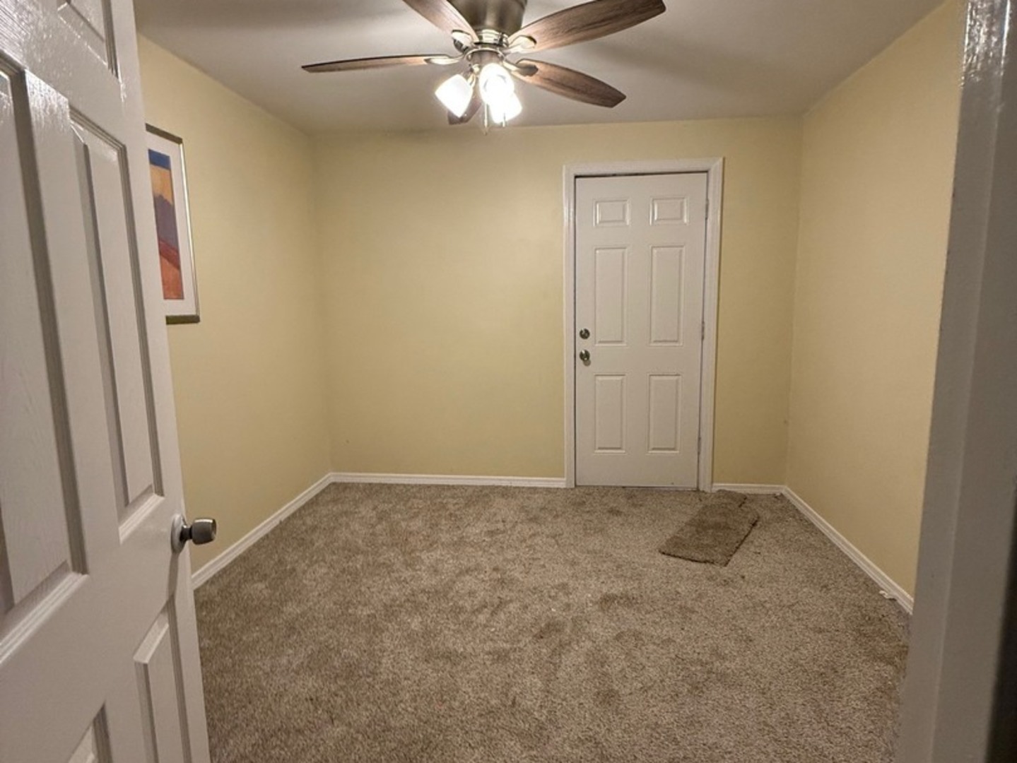 38455 North Sheridan Road, Unit 732 Beach Park, IL 60087 - Photo 25 of 25 an empty room with closet and a chandelier fan