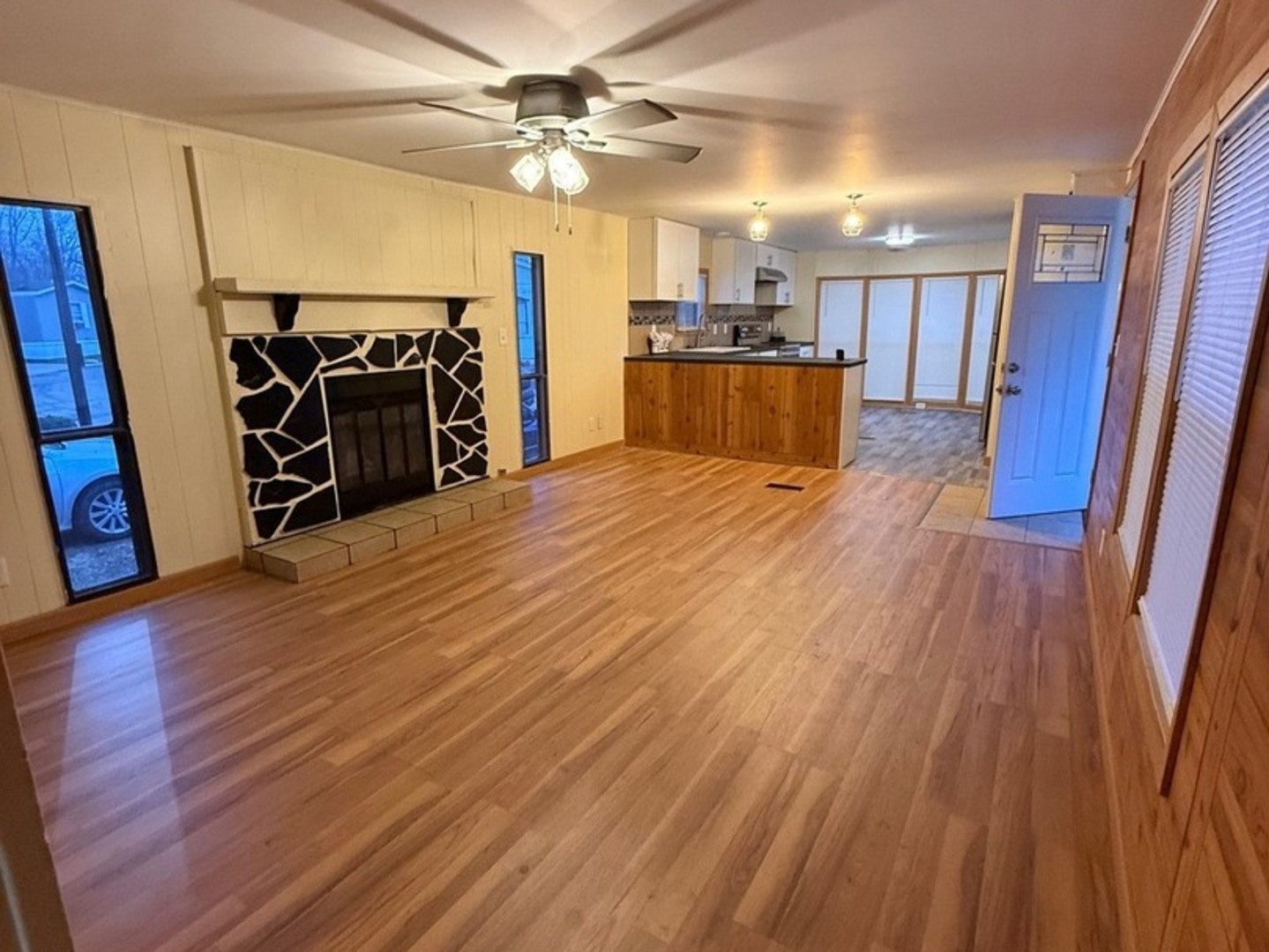 38455 North Sheridan Road, Unit 732 Beach Park, IL 60087 - Photo 10 of 25 a view of a room with wooden floor and a ceiling fan