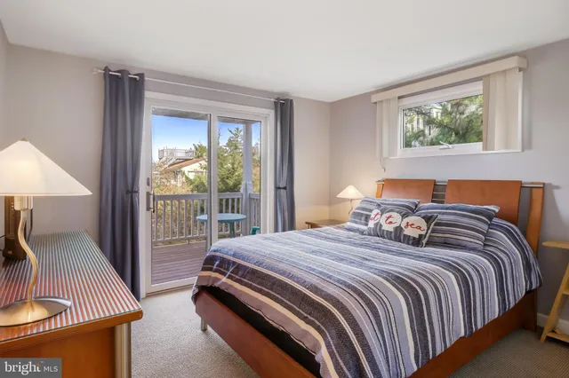 a bedroom with a large bed and a couch