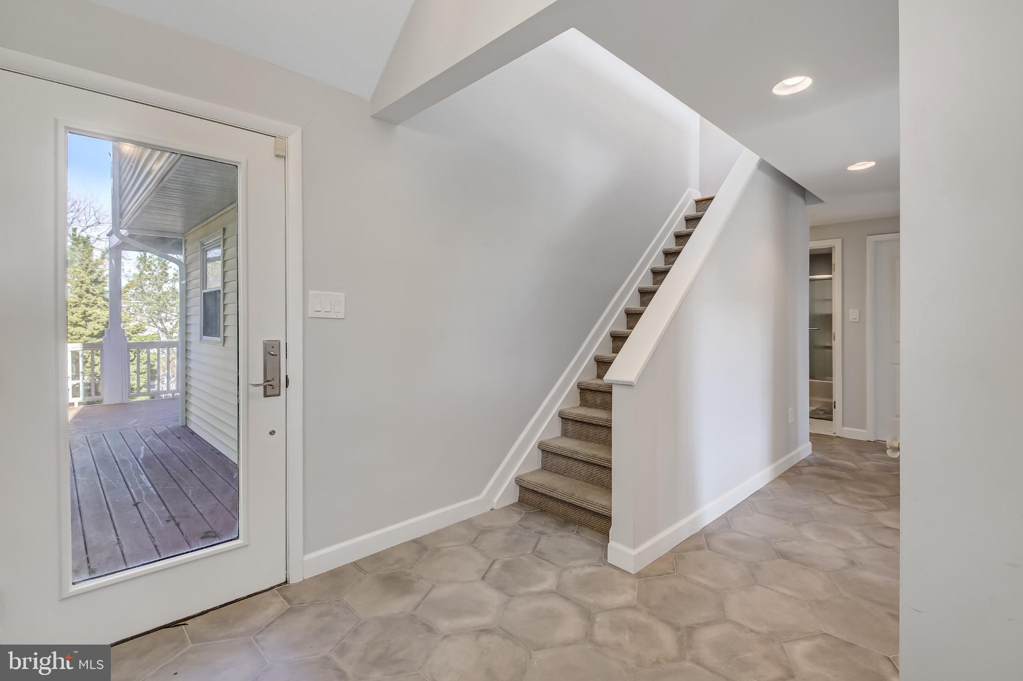 4 East 20th Street Barnegat Light, NJ 08006 - Photo 31 of 43 Bright and inviting entryway with stairs.