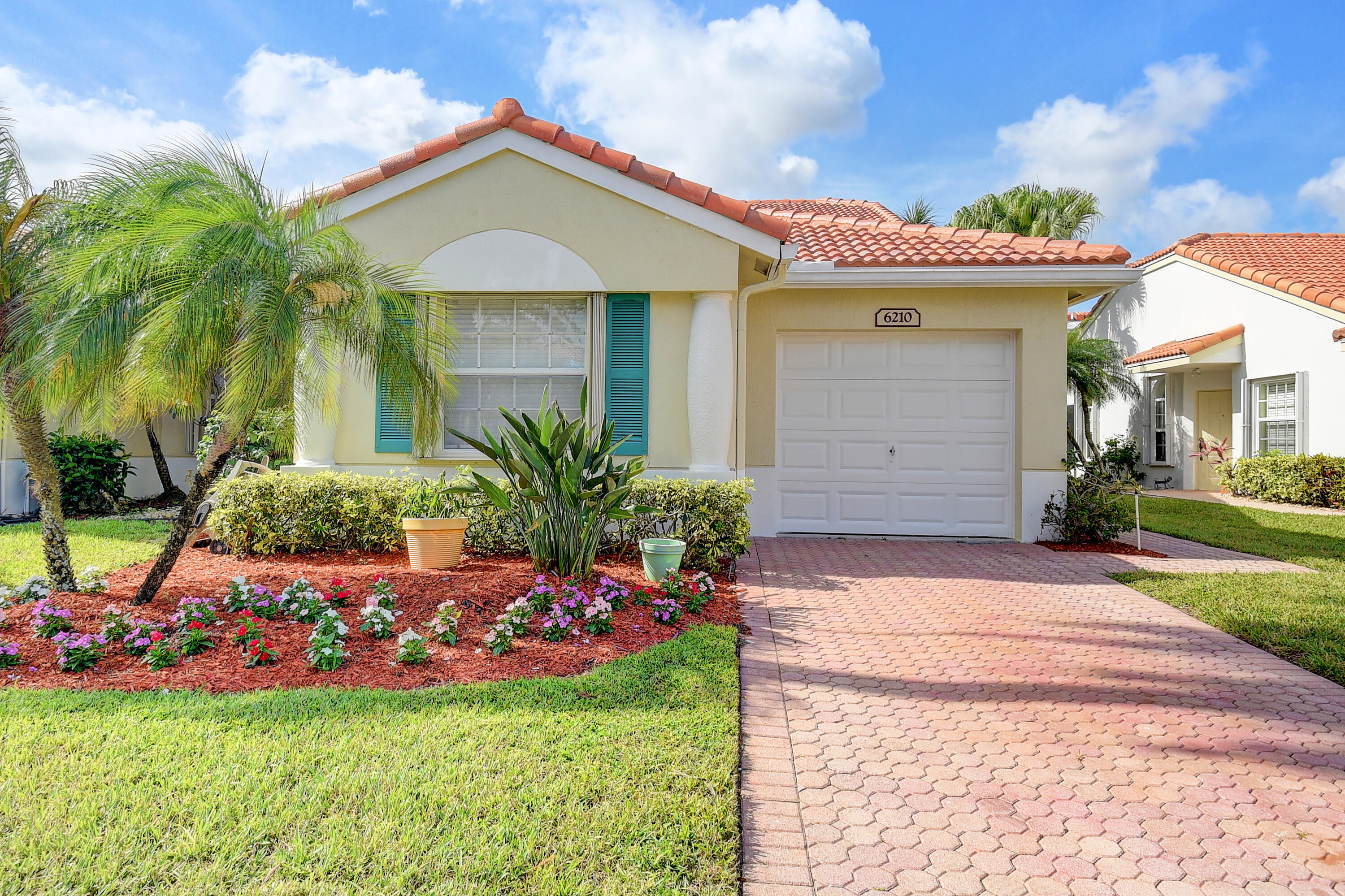 6210 Caladium Road Delray Beach, FL 33484 - Photo 1 of 59 a front view of house with yard and green space