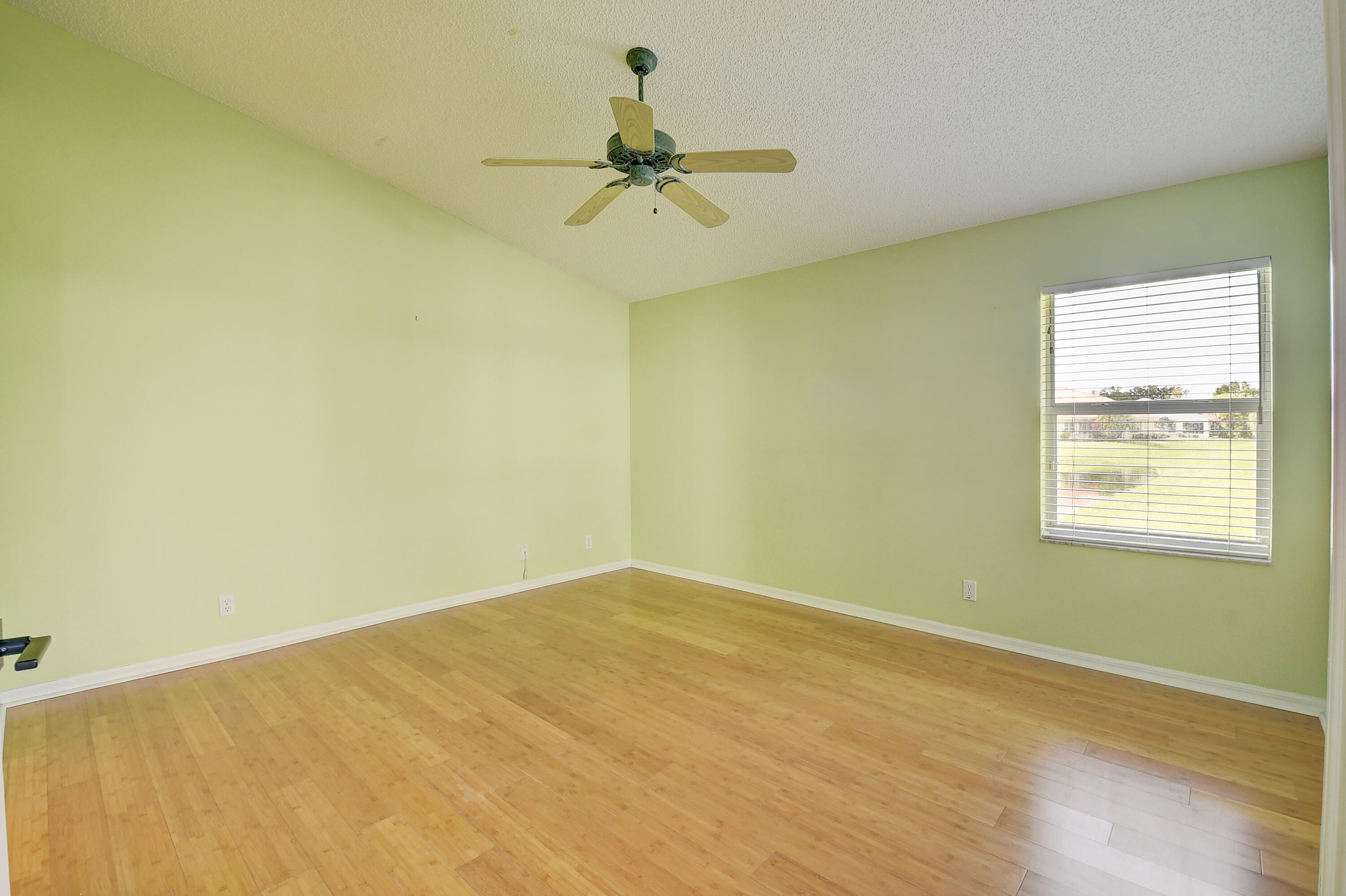 6210 Caladium Road Delray Beach, FL 33484 - Photo 18 of 59 an empty room with a window and a ceiling fan