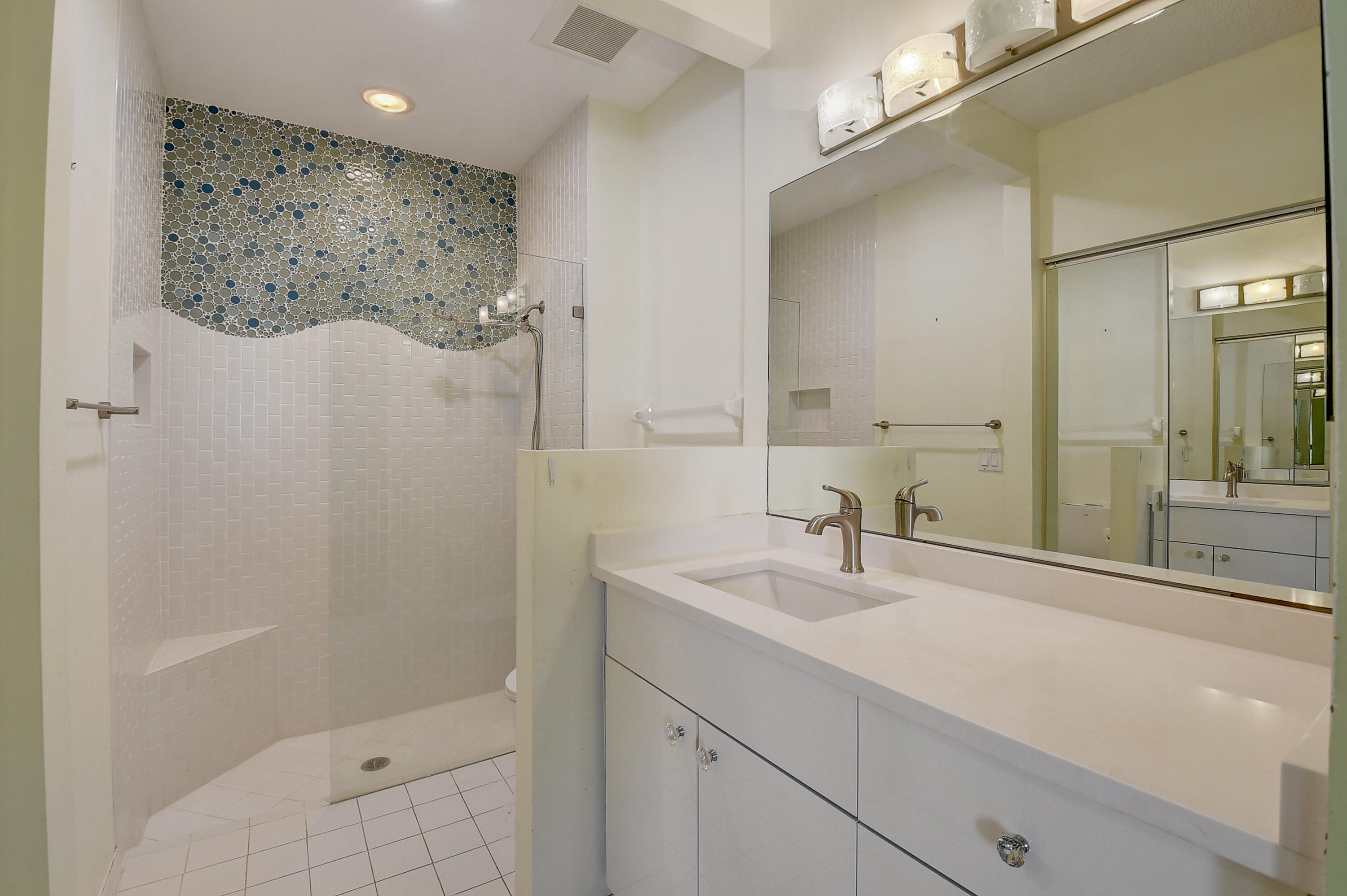 6210 Caladium Road Delray Beach, FL 33484 - Photo 20 of 59 a bathroom with a sink a shower and a mirror