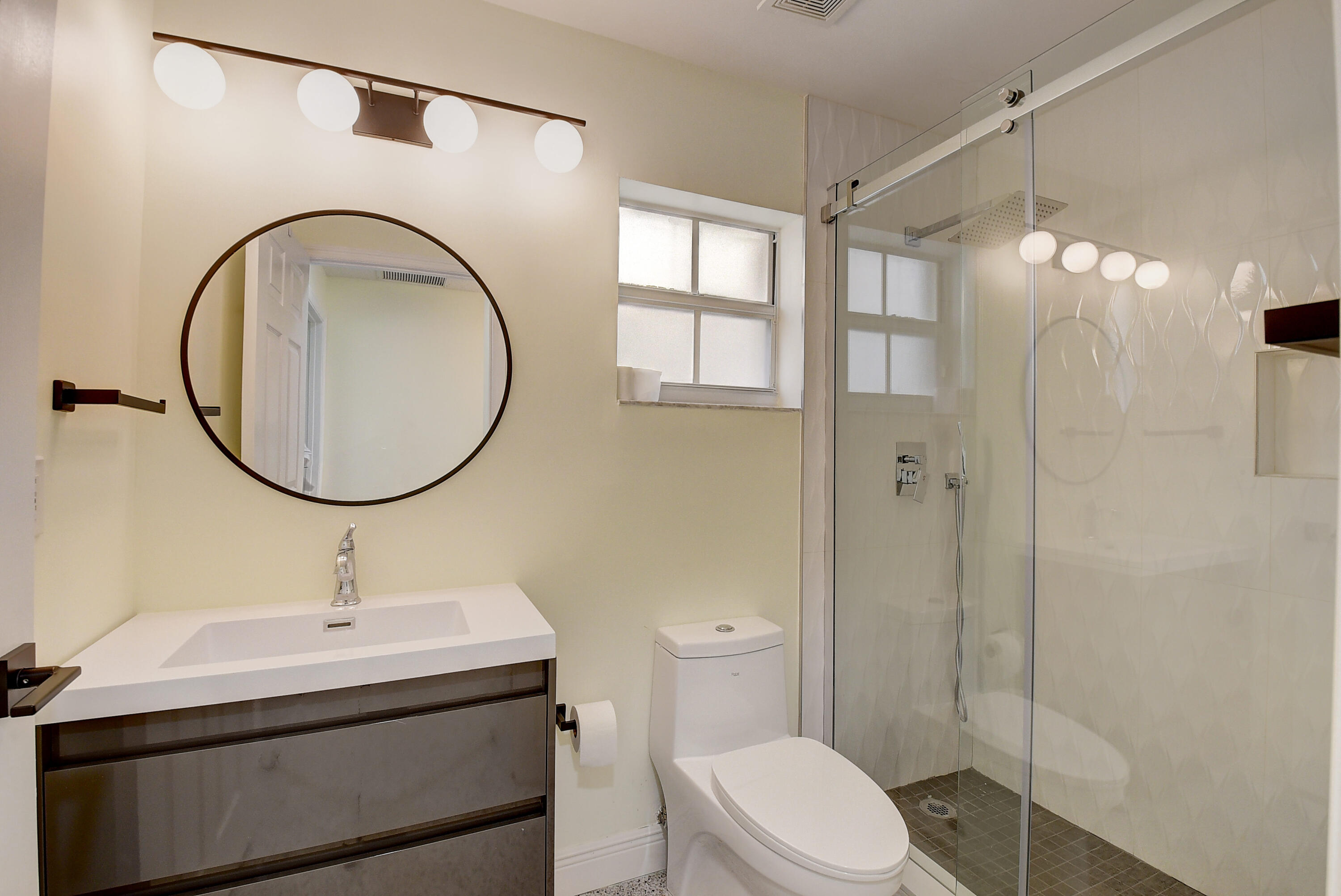 6210 Caladium Road Delray Beach, FL 33484 - Photo 25 of 59 a bathroom with a sink a toilet and a mirror