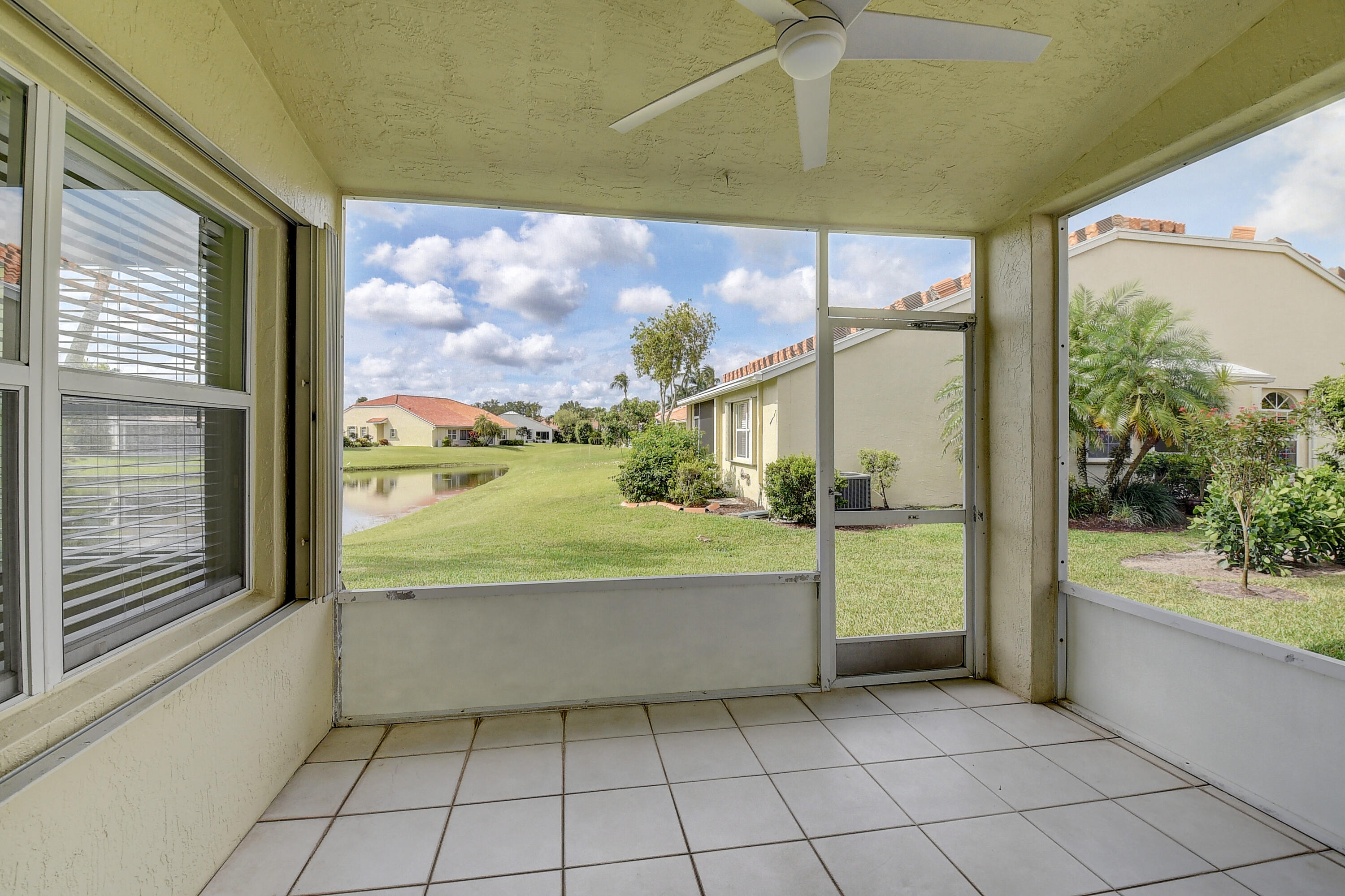 6210 Caladium Road Delray Beach, FL 33484 - Photo 27 of 59 a view of a bathroom with a bathtub and door