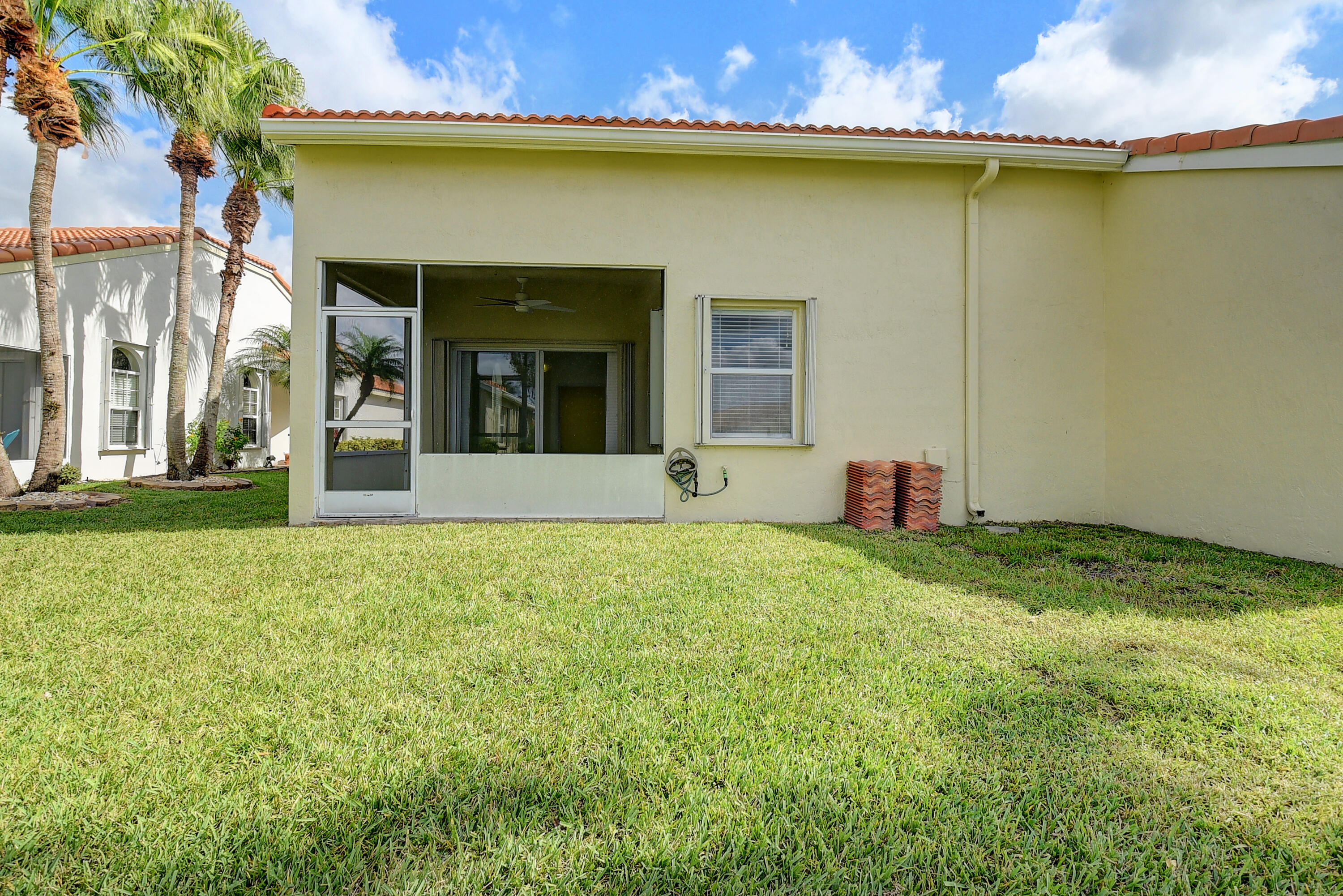 6210 Caladium Road Delray Beach, FL 33484 - Photo 30 of 59 a view of a house with a garden and yard