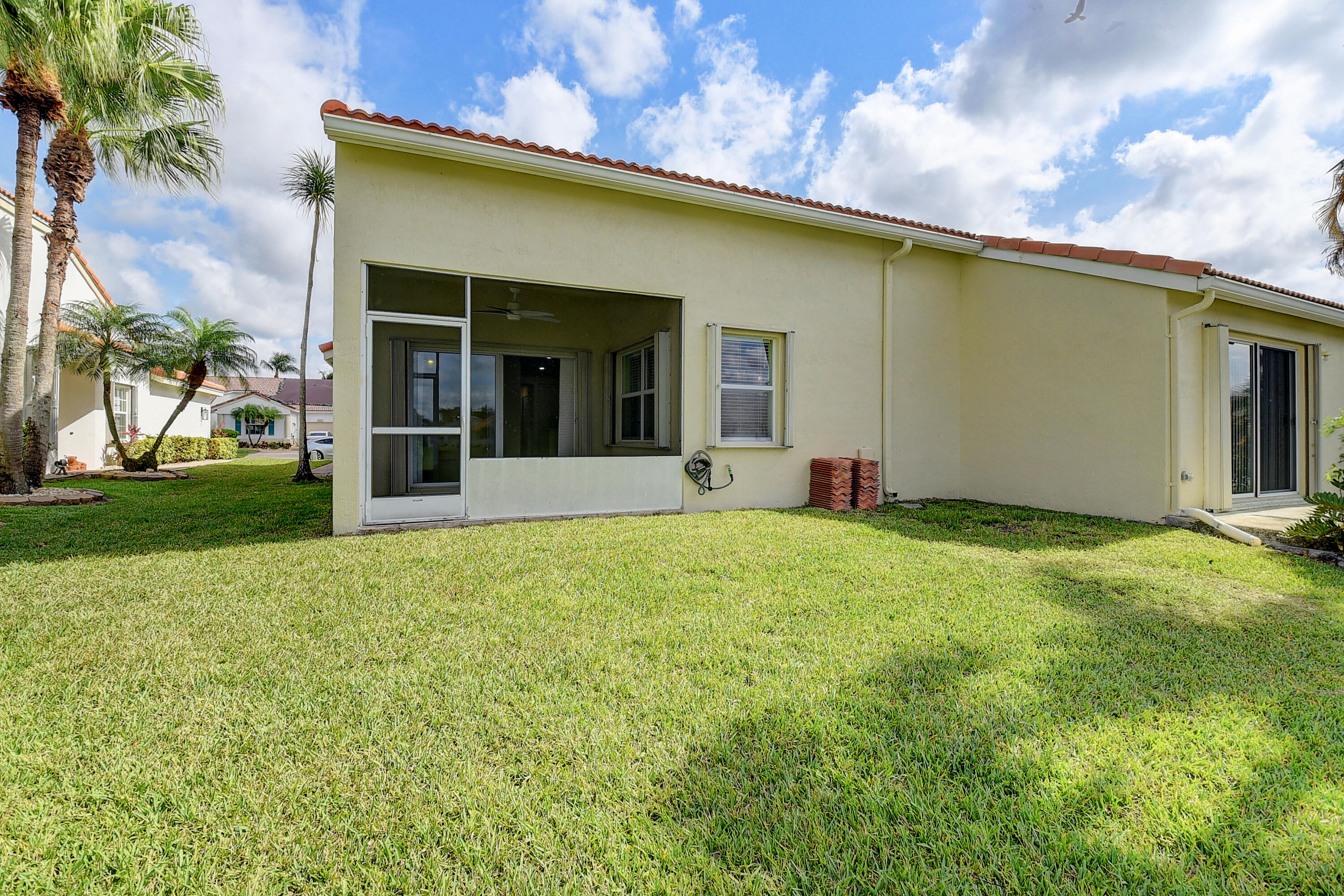 6210 Caladium Road Delray Beach, FL 33484 - Photo 31 of 59 front view of a house with a yard