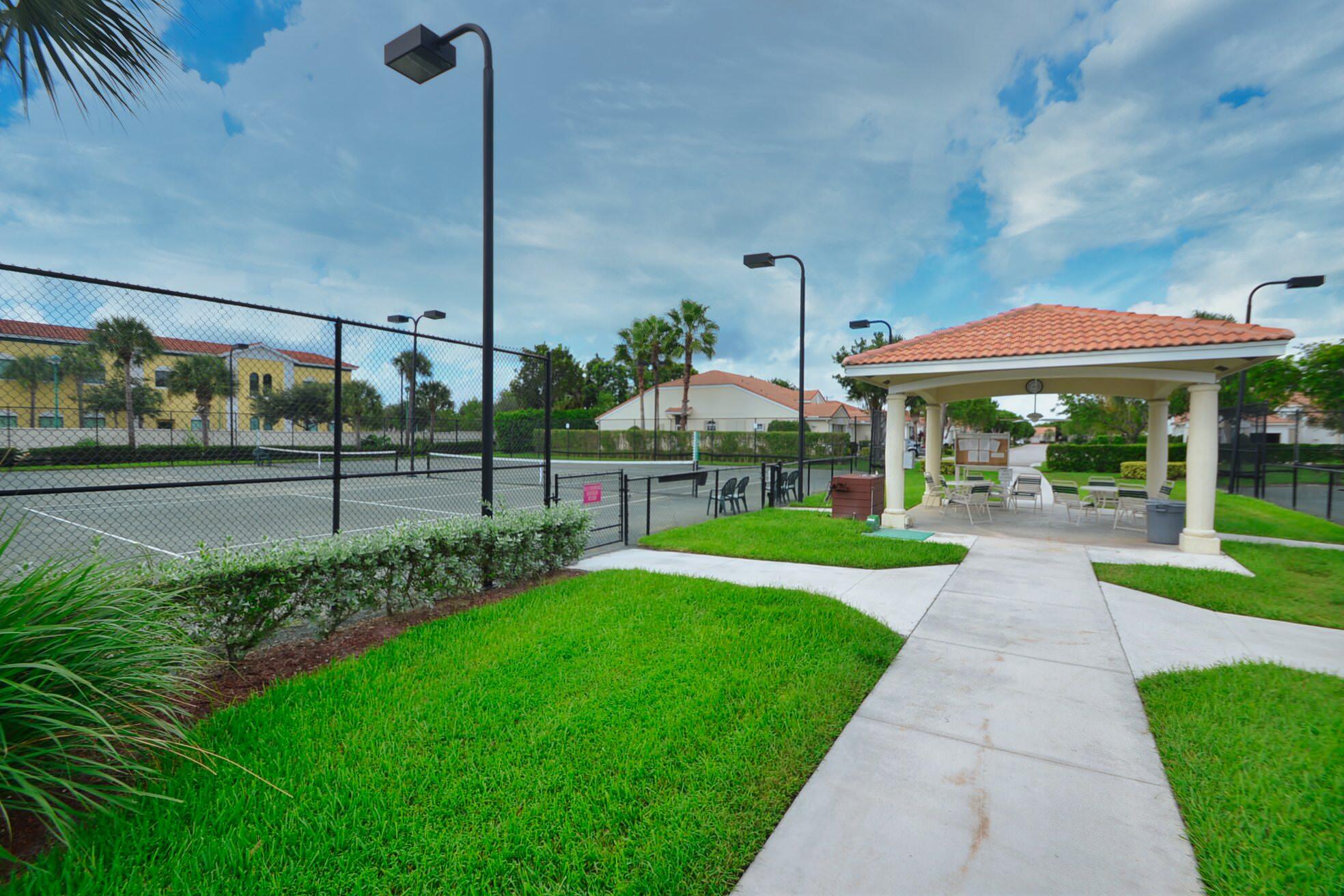6210 Caladium Road Delray Beach, FL 33484 - Photo 43 of 59 a view of a house with backyard and a garden