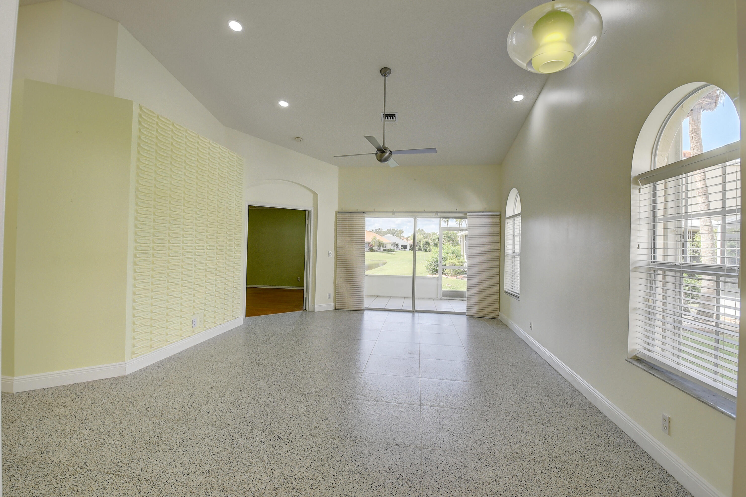 6210 Caladium Road Delray Beach, FL 33484 - Photo 7 of 59 an empty room with window and wooden floor