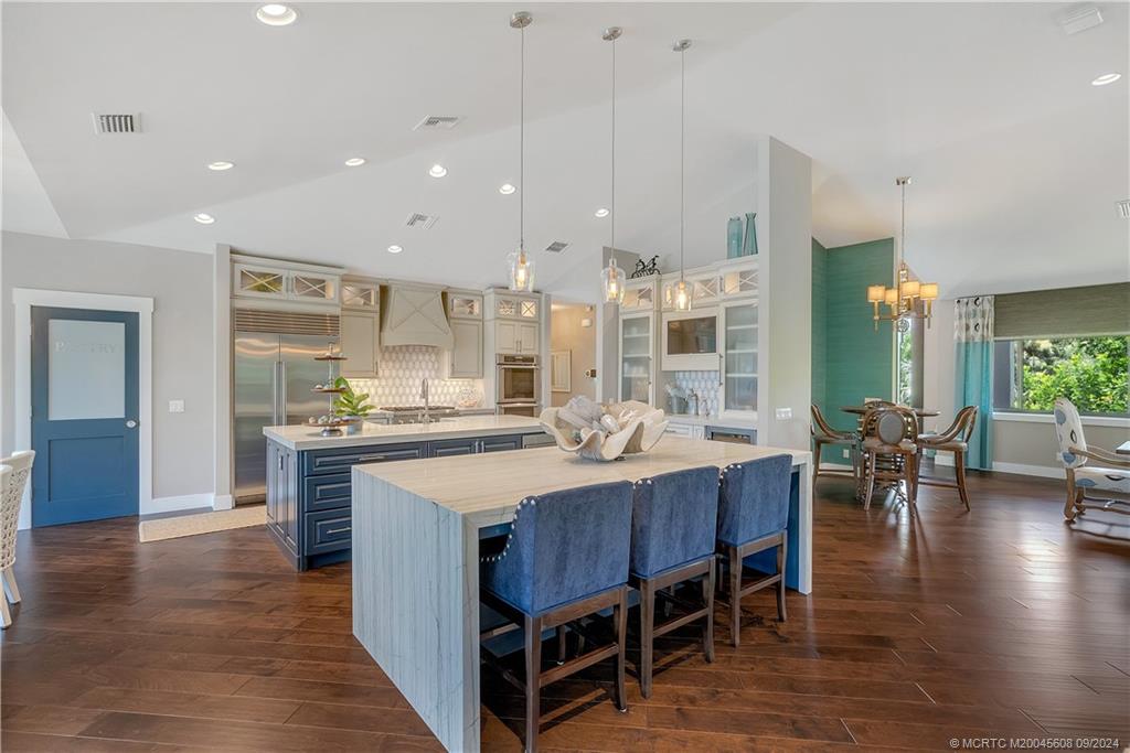 12 North Sewalls Point Road Stuart, FL 34996 - Photo 11 of 75 a large kitchen with a table and chairs