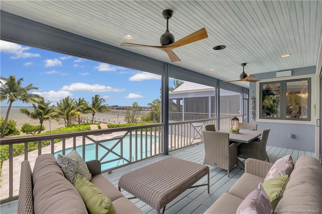 12 North Sewalls Point Road Stuart, FL 34996 - Photo 30 of 75 a balcony with furniture and a table