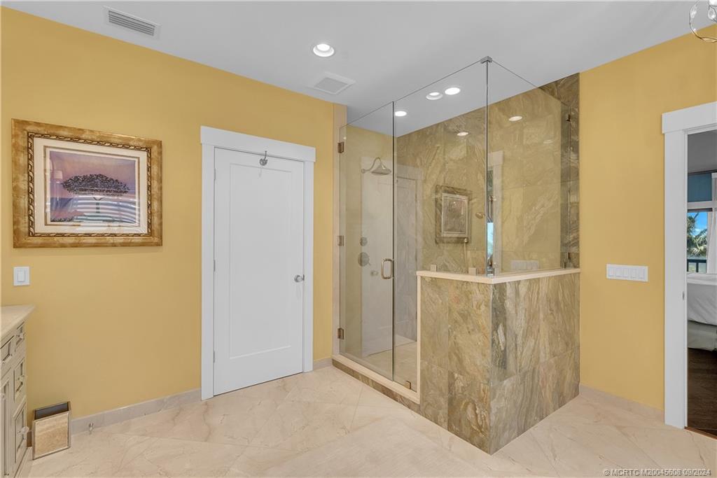 12 North Sewalls Point Road Stuart, FL 34996 - Photo 43 of 75 a bathroom with a mirror