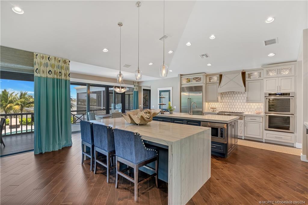 12 North Sewalls Point Road Stuart, FL 34996 - Photo 10 of 75 a kitchen with a table and chairs in it