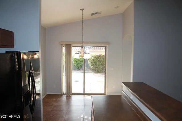 a view of room with window and wooden floor