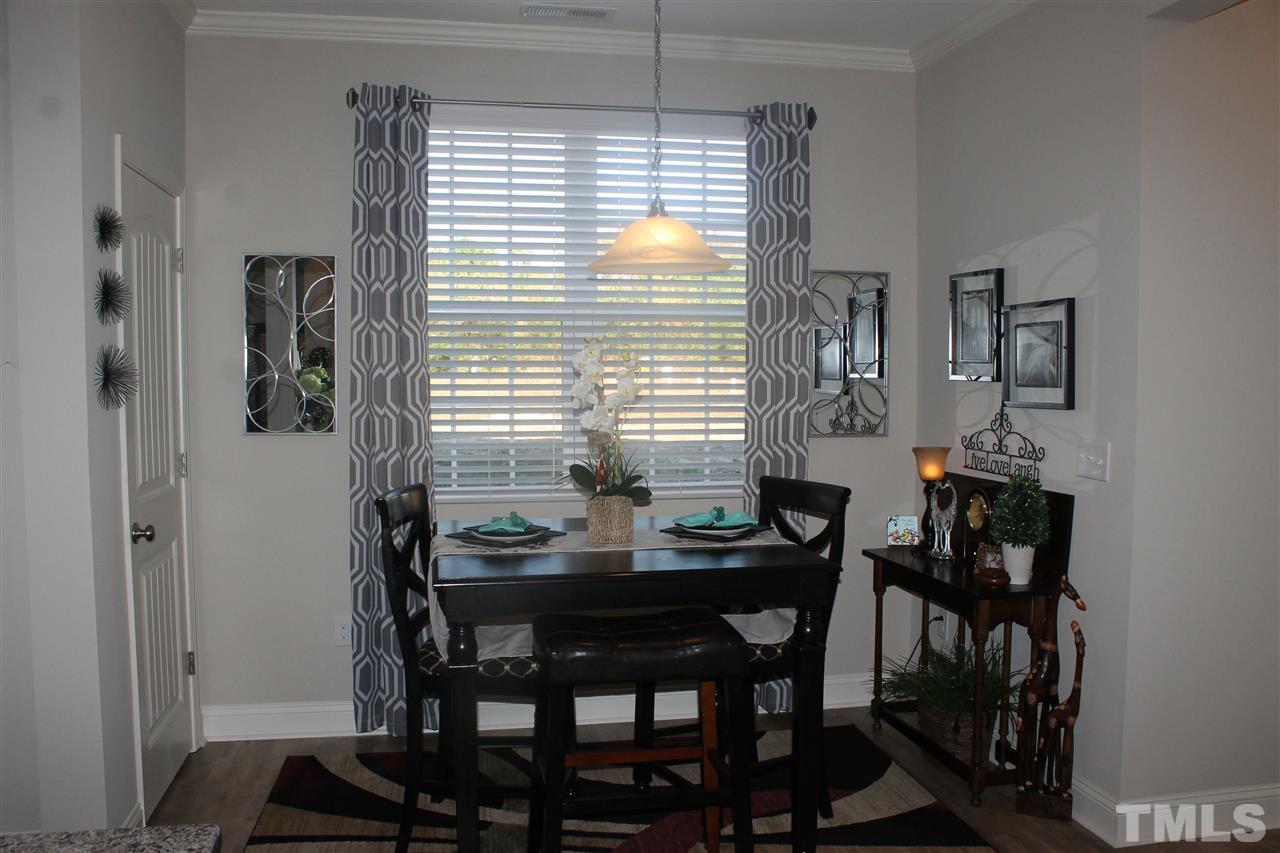 3902 Volkswalk Place Raleigh, NC 27610 - Photo 10 of 21 a dining room with furniture and window