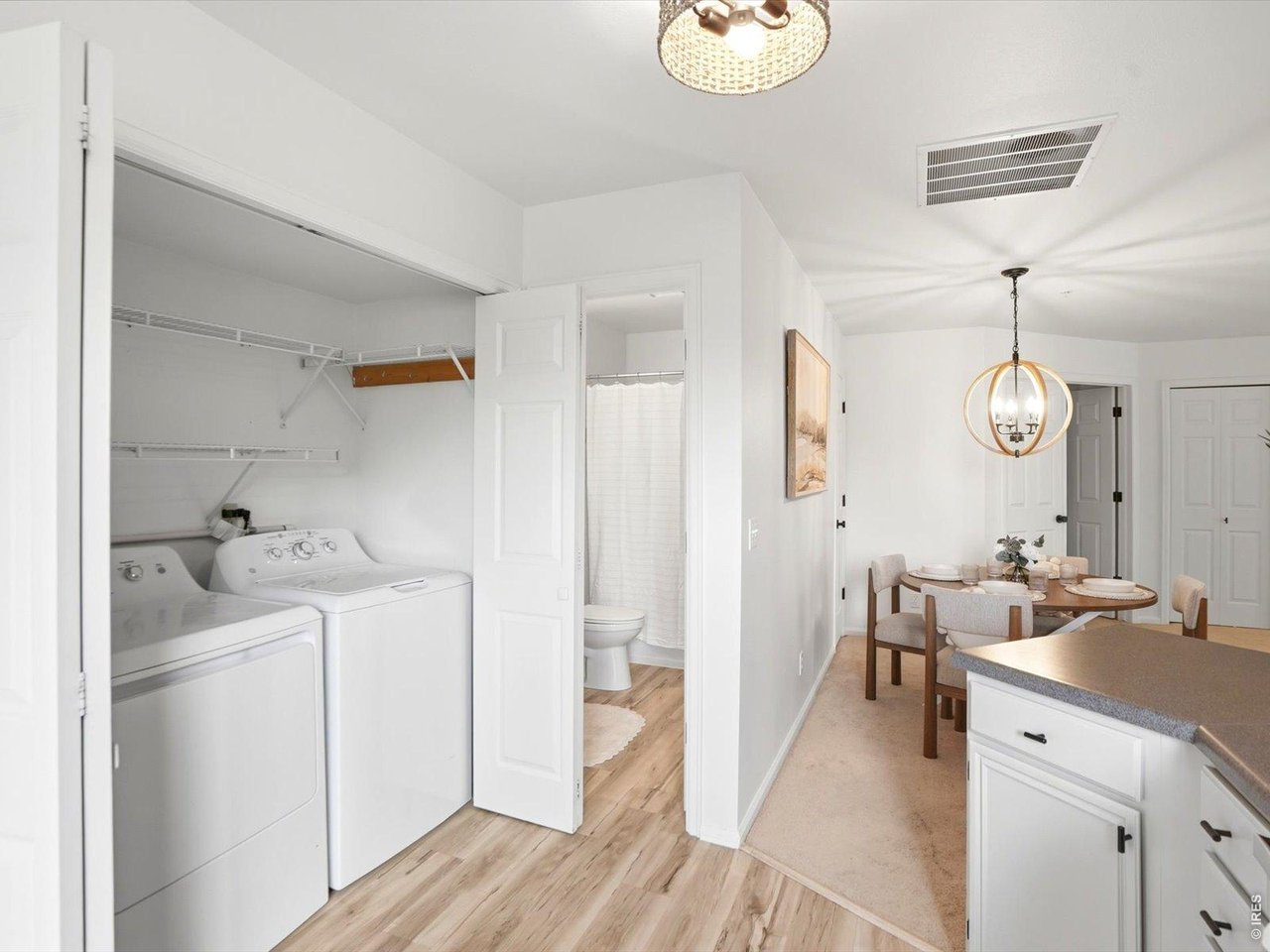 4945 Twin Lakes Road, Unit 46 Boulder, CO 80301 - Photo 23 of 42 Conveniently located laundry closet and full guest bath just off the kitchen for everyday functionality.