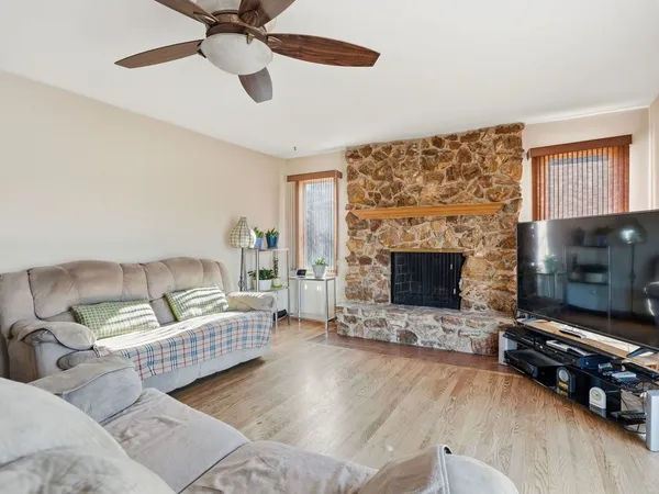 a living room with furniture and a fireplace
