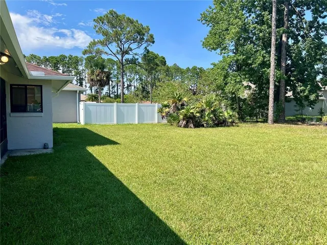a view of a backyard with garden