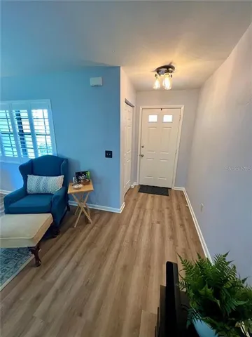 a view of livingroom with furniture and wooden floor
