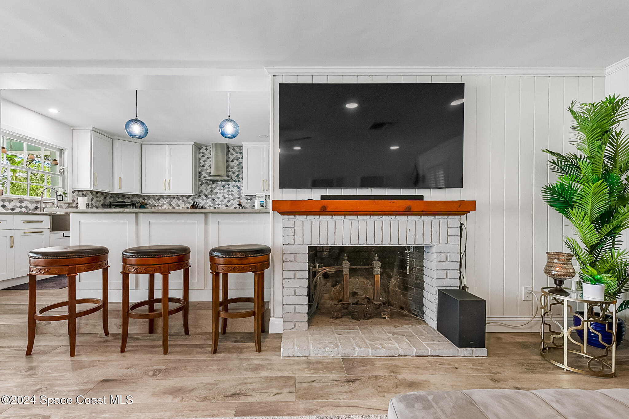 200 Melbourne Avenue Indialantic, FL 32903 - Photo 23 of 60 a kitchen with furniture and a fireplace