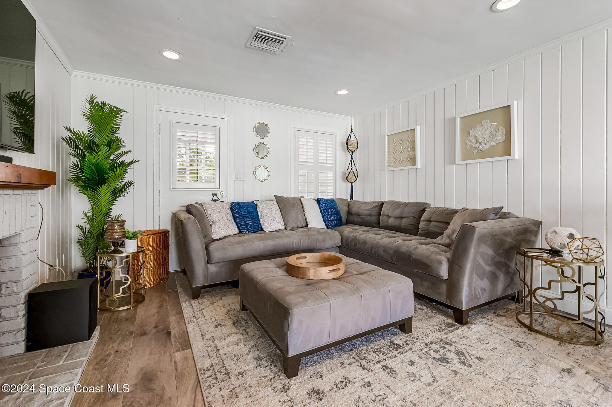 200 Melbourne Avenue Indialantic, FL 32903 - Photo 24 of 60 a living room with furniture and a potted plant