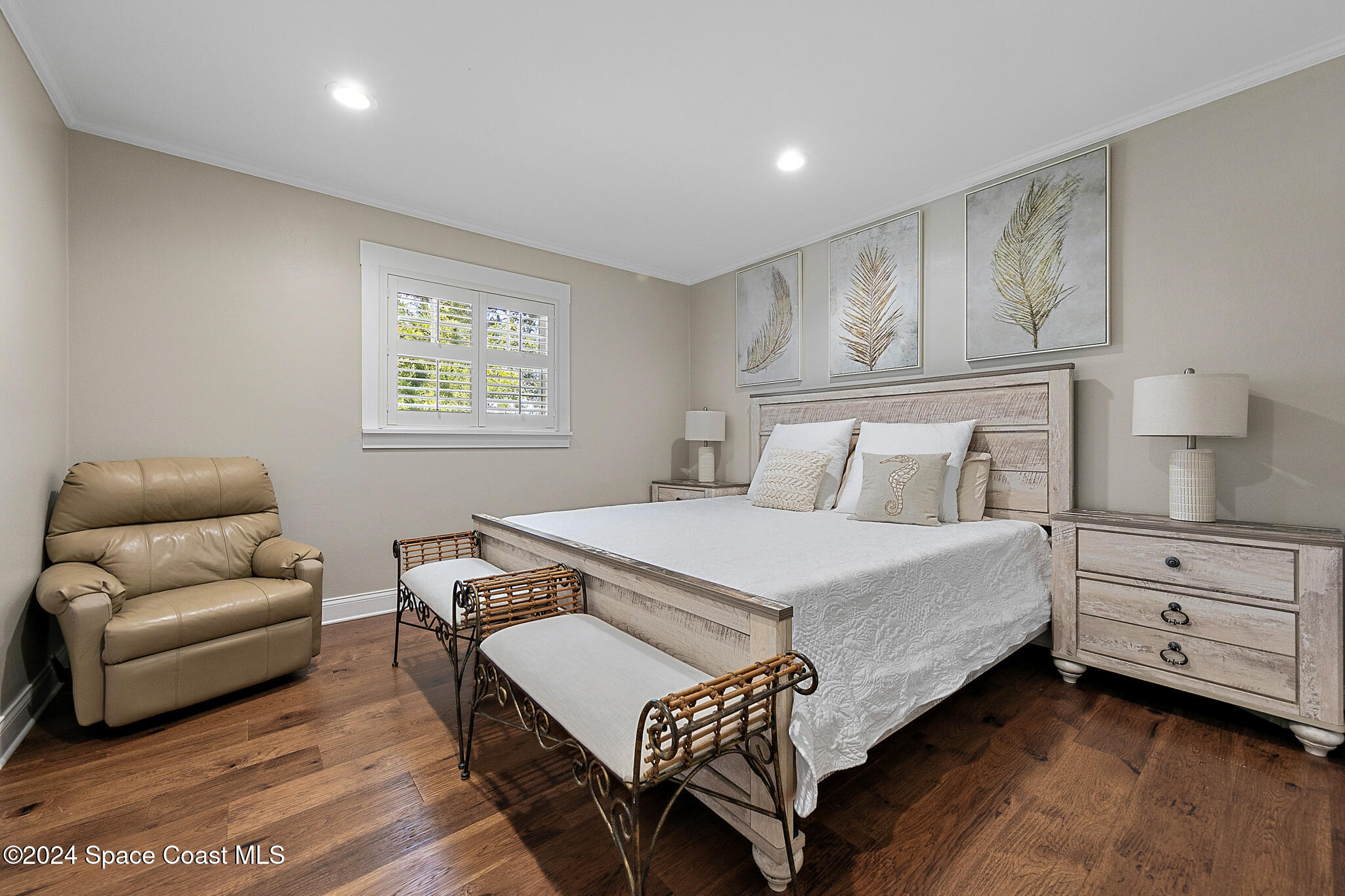 200 Melbourne Avenue Indialantic, FL 32903 - Photo 25 of 60 a bedroom with a bed and a couch