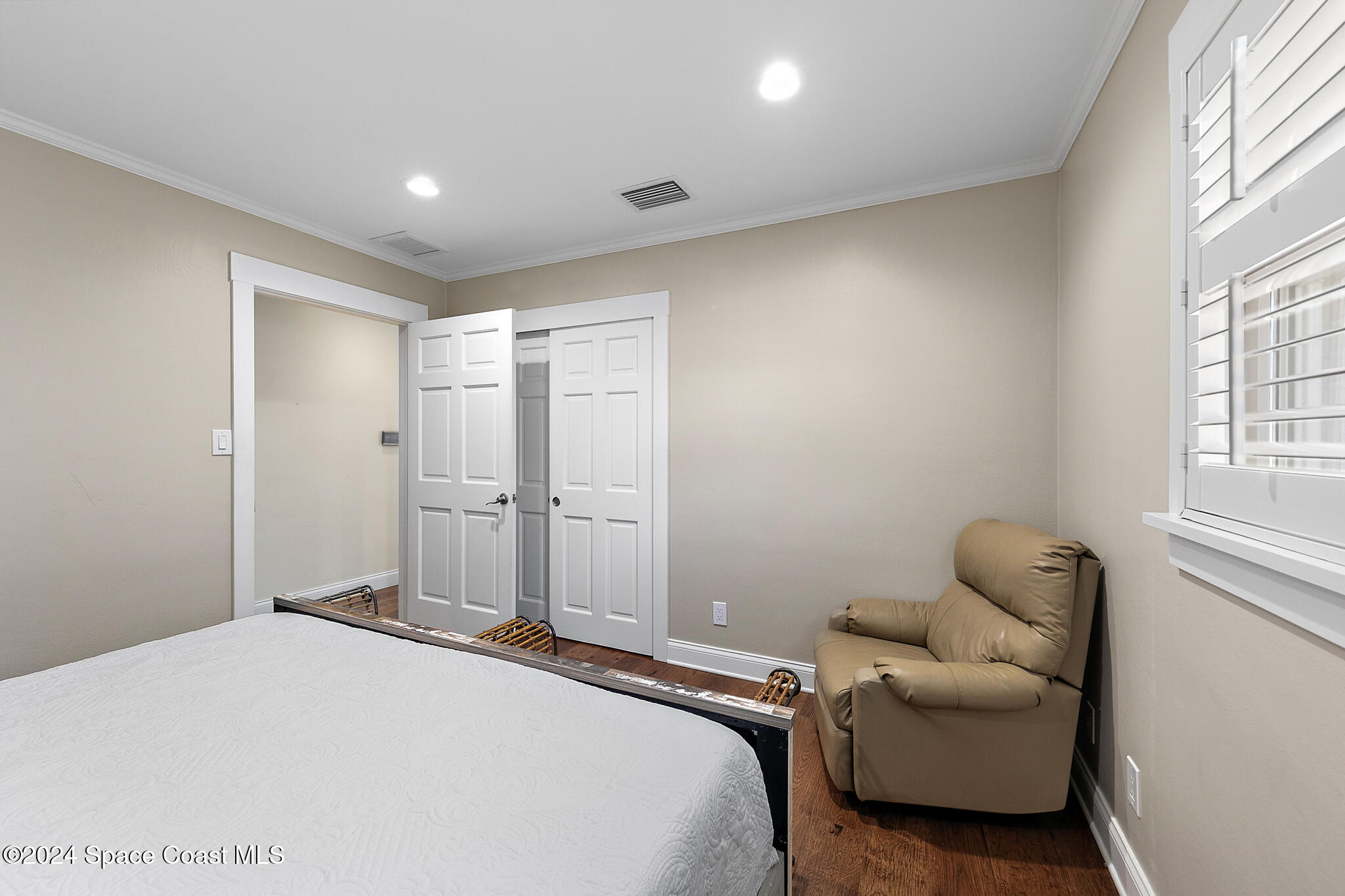 200 Melbourne Avenue Indialantic, FL 32903 - Photo 26 of 60 a bedroom with a bed and a window