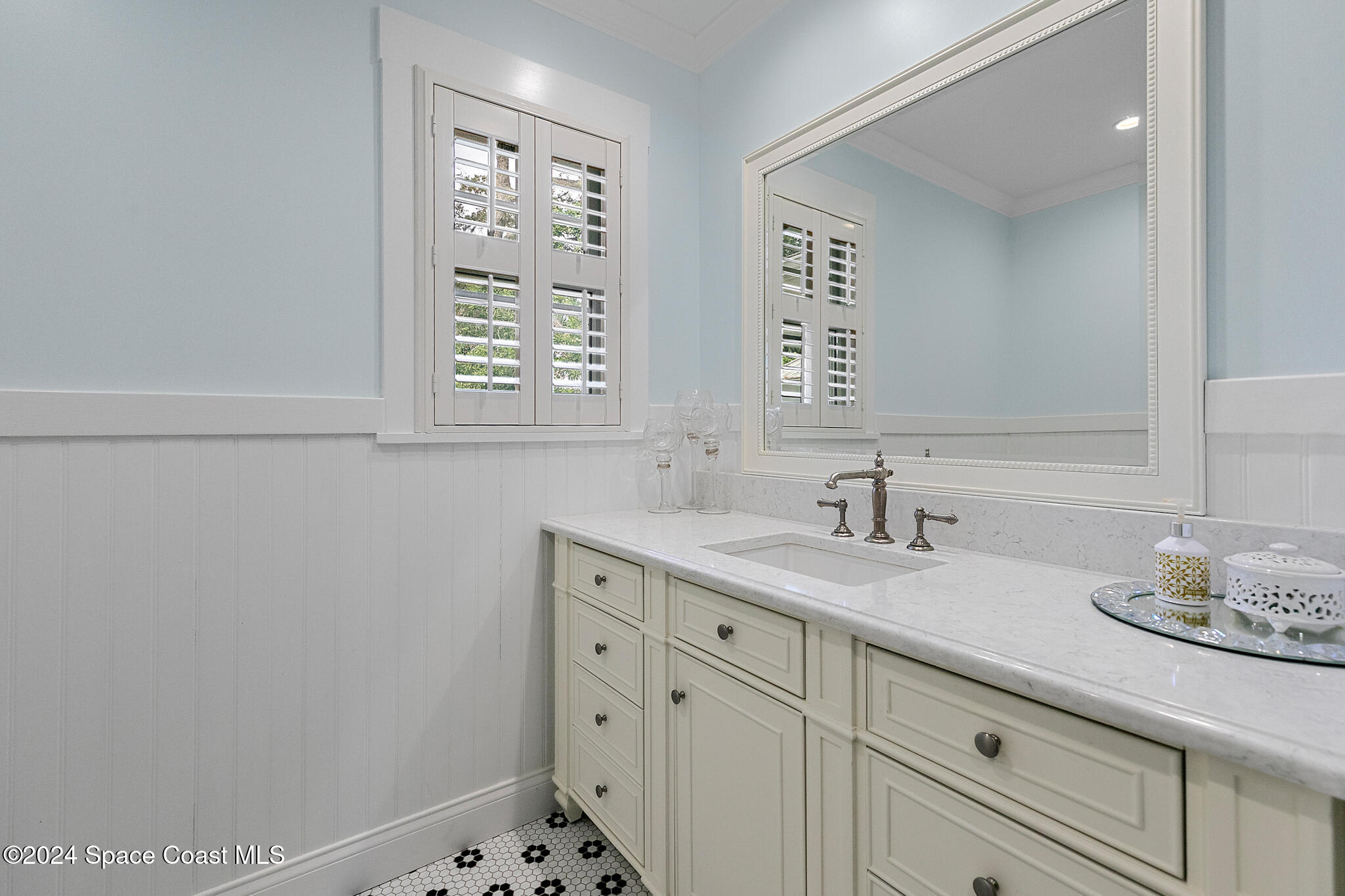 200 Melbourne Avenue Indialantic, FL 32903 - Photo 29 of 60 a bathroom with a sink and a mirror