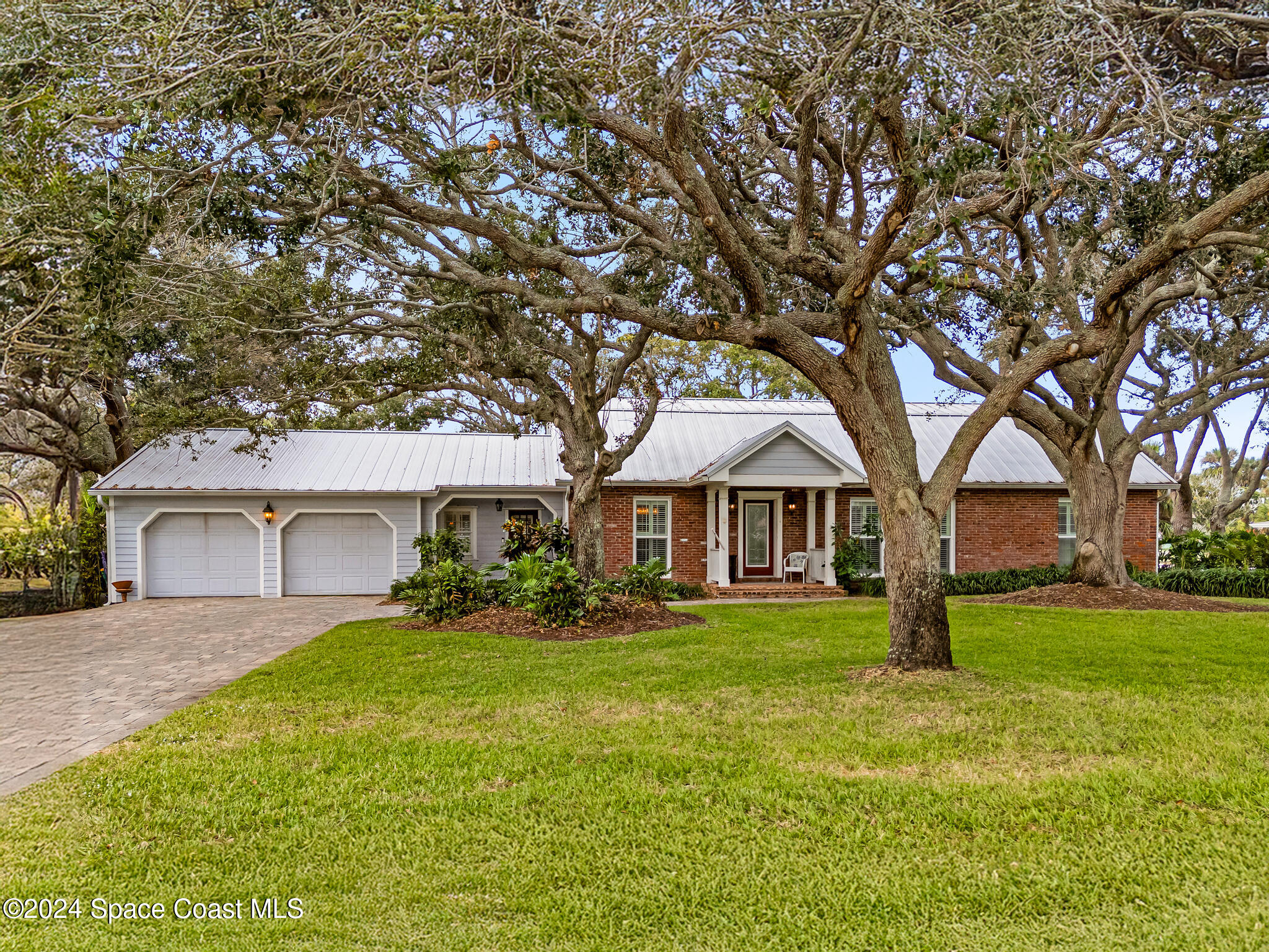 200 Melbourne Avenue Indialantic, FL 32903 - Photo 3 of 60 front view of a house with a yard