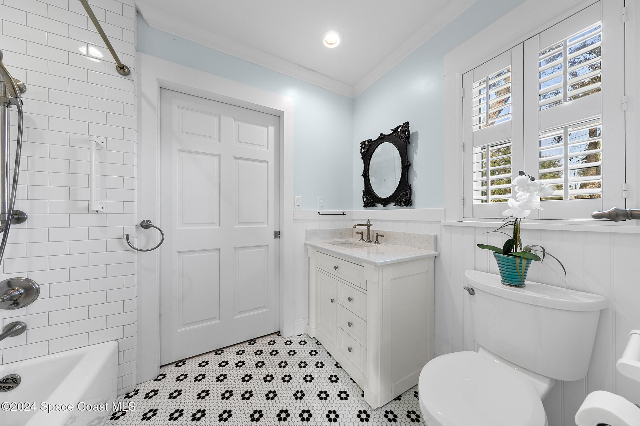 200 Melbourne Avenue Indialantic, FL 32903 - Photo 33 of 60 a bathroom with a sink a toilet and shower