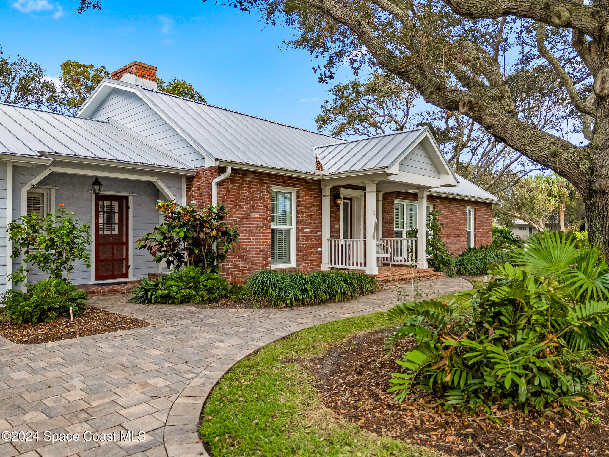 200 Melbourne Avenue Indialantic, FL 32903 - Photo 5 of 60 front view of a house with a yard