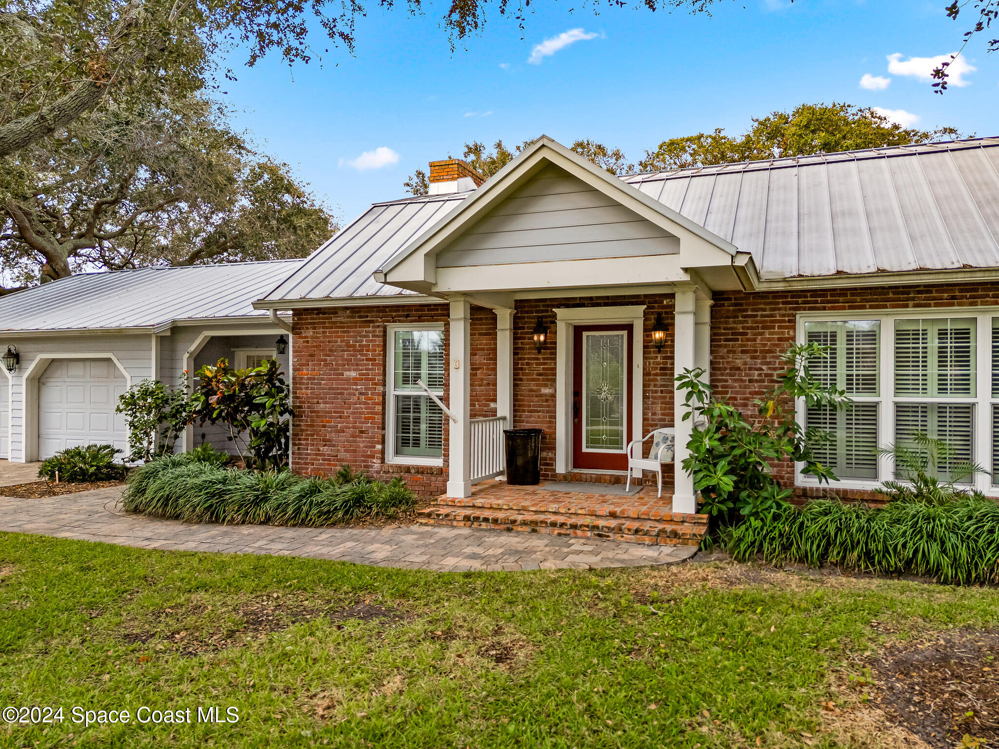 200 Melbourne Avenue Indialantic, FL 32903 - Photo 6 of 60 front view of a house with a yard