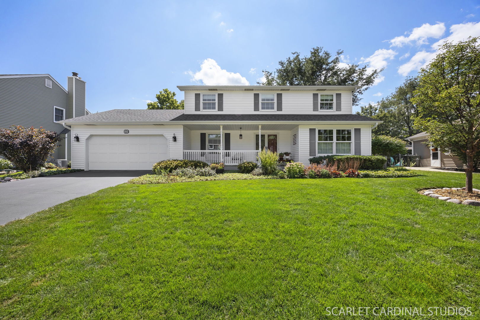 192 Cassin Road Naperville, IL 60565 - Photo 1 of 1 a front view of a house with garden and trees