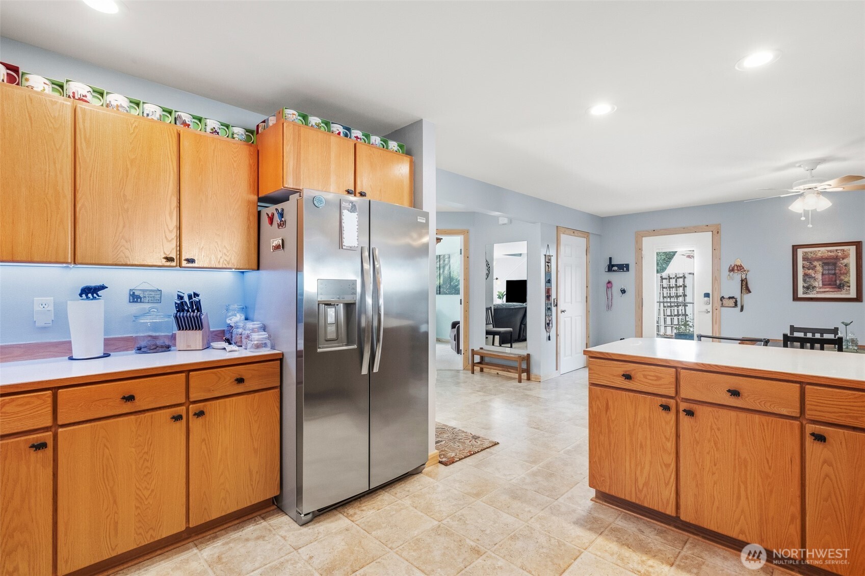 8348 Main Street, Unit 1 Peshastin, WA 98847 - Photo 13 of 40 a kitchen with white cabinets sink and stainless steel appliances