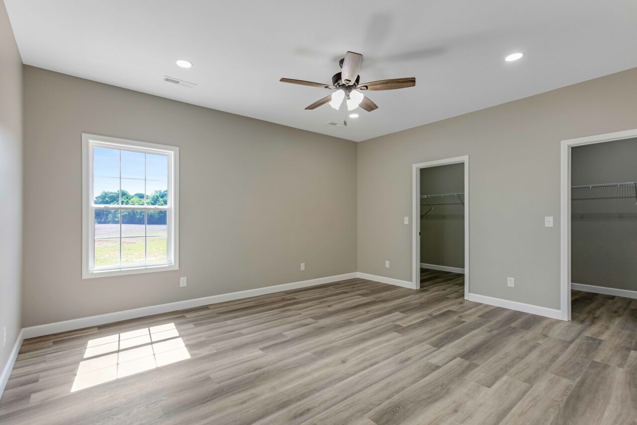 146 Carl Williams Road Crofton, KY 42217 - Photo 14 of 30 a view of an empty room with wooden floor and a window