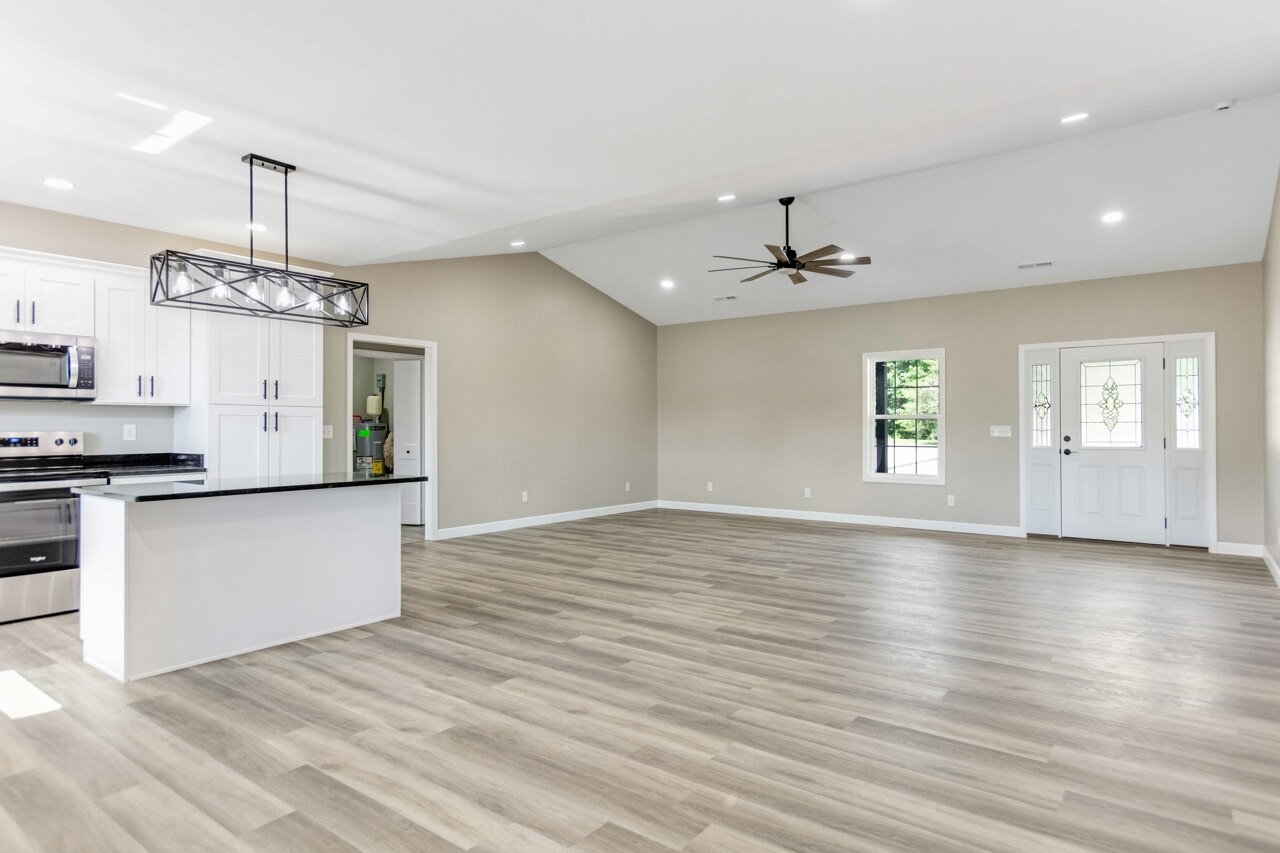 146 Carl Williams Road Crofton, KY 42217 - Photo 6 of 30 a view of a kitchen with wooden floor and a sink