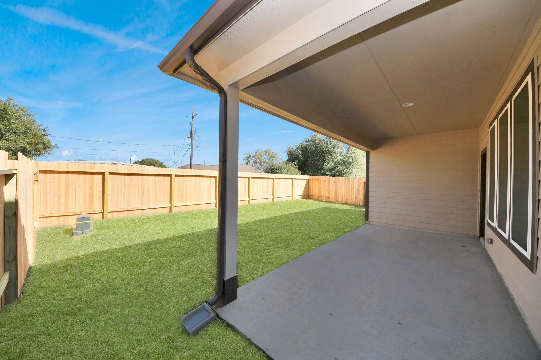 24519 Broad Park Spring, TX 77373 - Photo 36 of 36 Experience outdoor living at its finest on this expansive covered patio, thoughtfully designed for BBQs and delightful outdoor dining. Sample photo of completed home with similar floor plan. Actual colors and selections may vary.