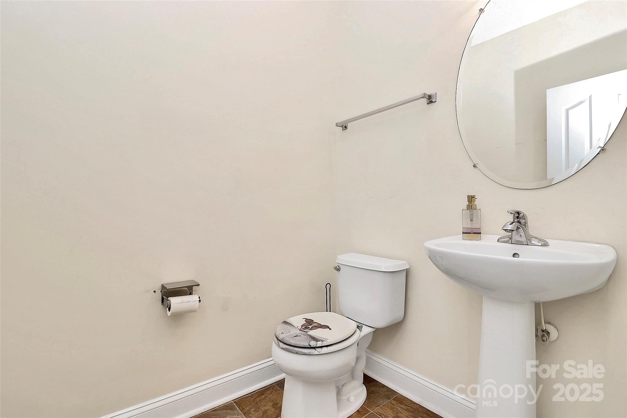 7827 Kuck Road Mint Hill, NC 28227 - Photo 15 of 37 a bathroom with a toilet sink and mirror