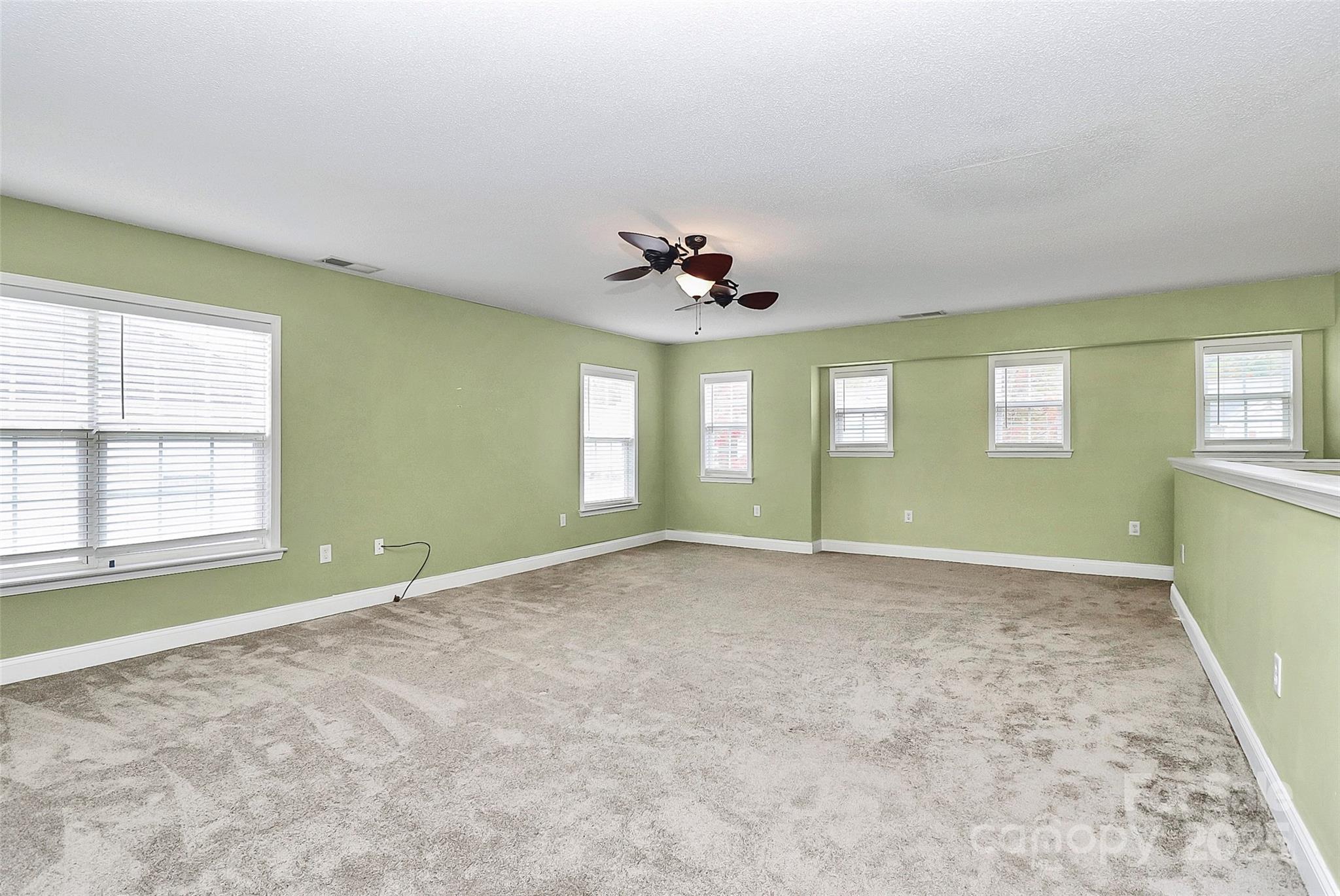 7827 Kuck Road Mint Hill, NC 28227 - Photo 17 of 37 a view of an empty room with a window