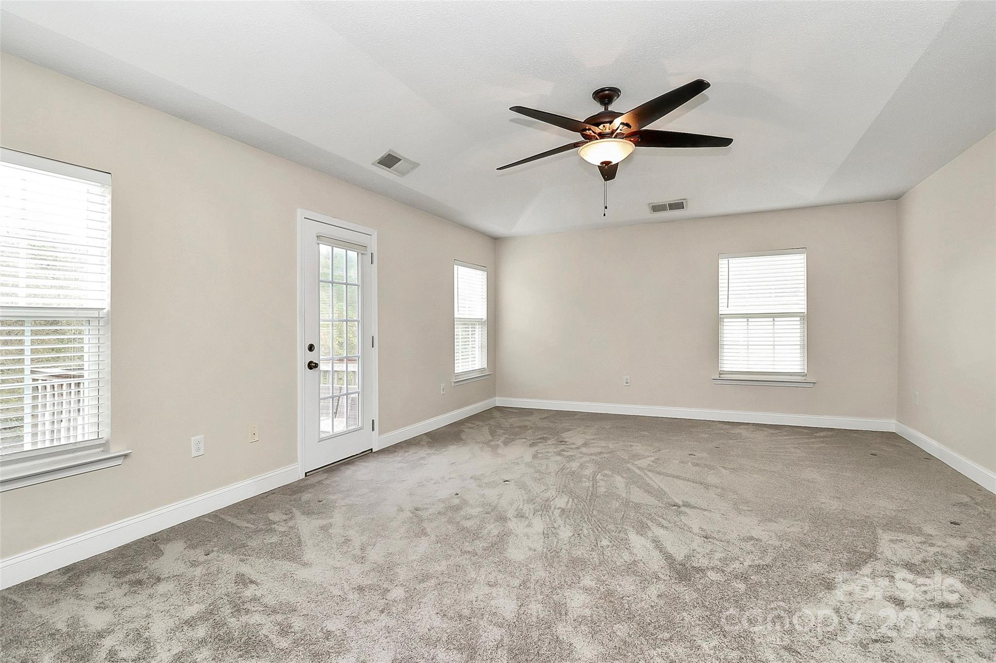 7827 Kuck Road Mint Hill, NC 28227 - Photo 23 of 37 a view of empty room with wooden floor and fan