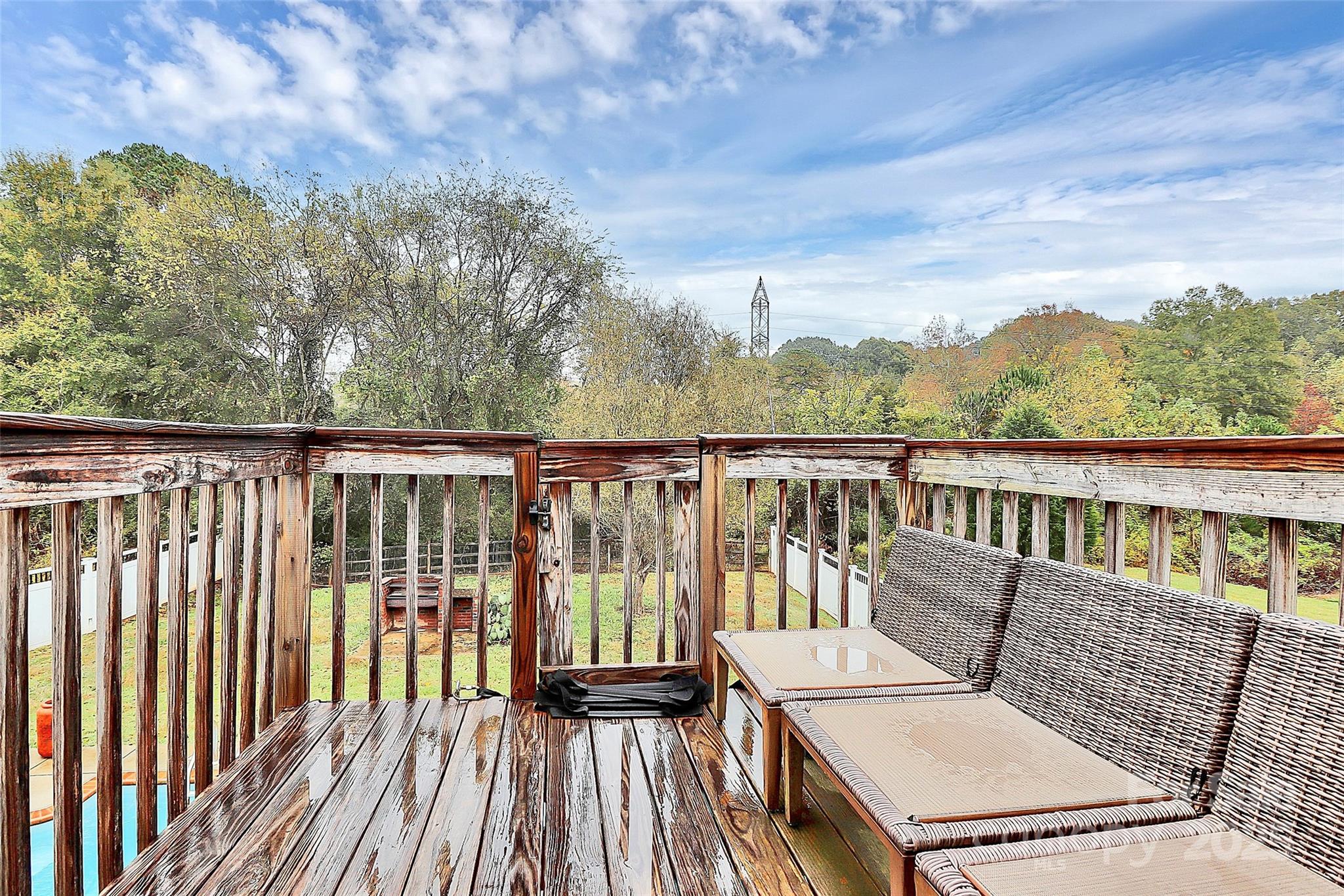 7827 Kuck Road Mint Hill, NC 28227 - Photo 28 of 37 a view of a balcony with couches and wooden floor
