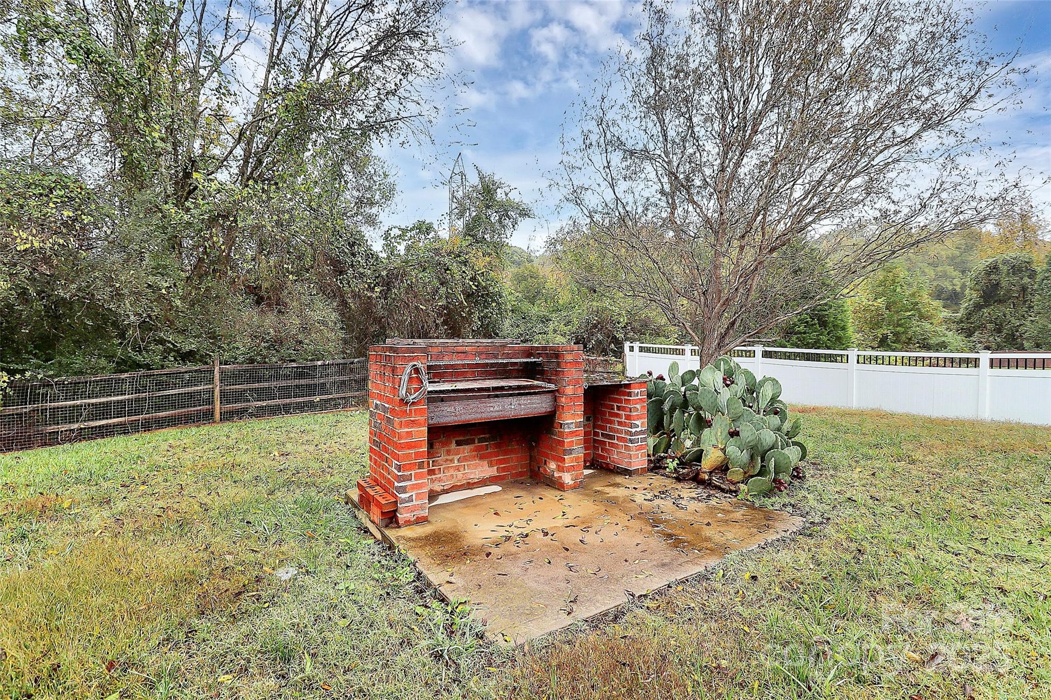 7827 Kuck Road Mint Hill, NC 28227 - Photo 31 of 37 a backyard of a house with barbeque oven