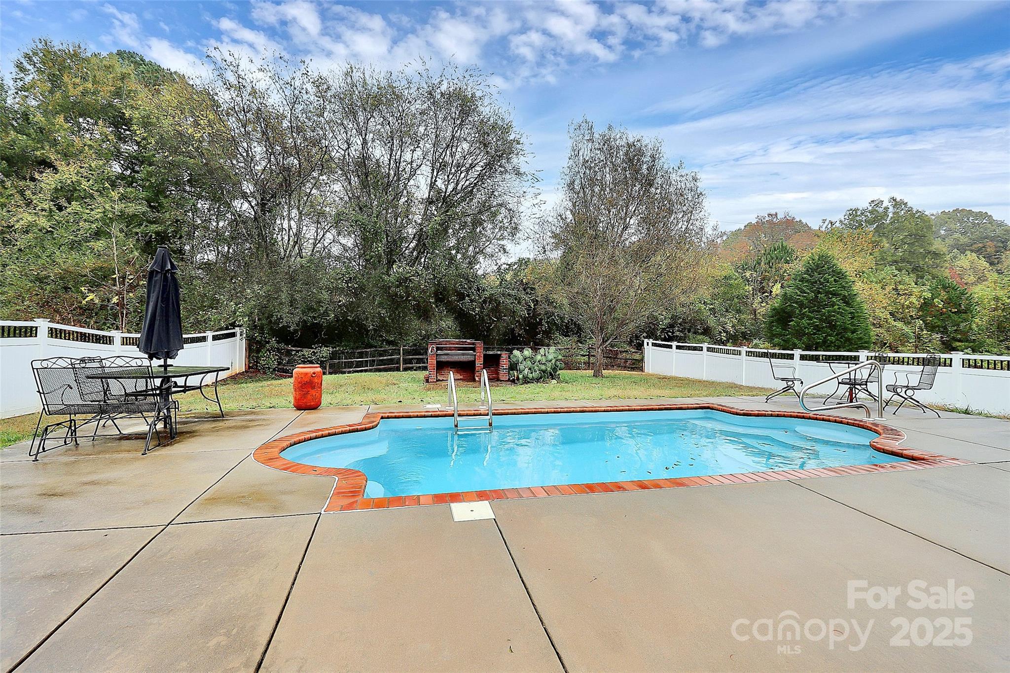 7827 Kuck Road Mint Hill, NC 28227 - Photo 34 of 37 a view of a swimming pool with an outdoor seating