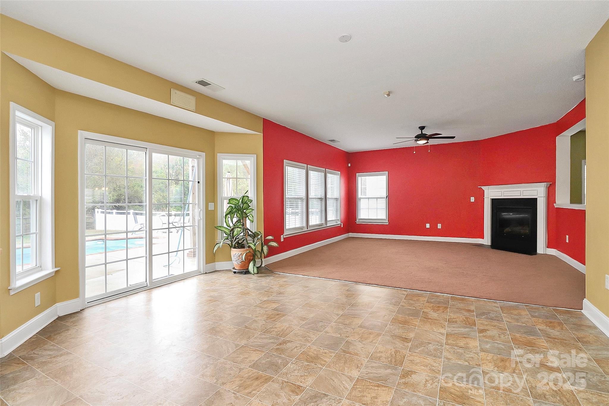 7827 Kuck Road Mint Hill, NC 28227 - Photo 10 of 37 a view of empty room with floor to ceiling window and tv